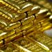 Precios del oro caen ante creciente interés por el riesgo